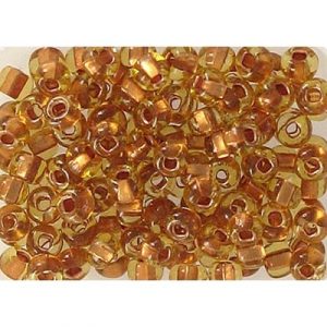 Perles de rocaille, en vrac, topaze claire doublée de cuivre, grandeur 6. Vendu en paquet de 500 grammes. (SKU# GBR6L/19020)